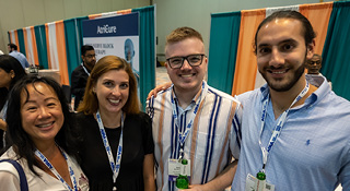 networking reception 4 smiling attendees at the networking reception