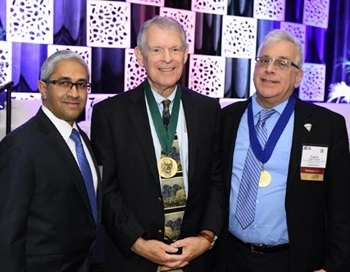 Dr. Joseph Neal (middle), was given the award at the 44th Annual Regional Anesthesiology and Acute Pain Medicine Meeting by Dr. Asokumar Buvanendran (left) and Dr. Eugene Viscusi (right), on April 13, 2019.